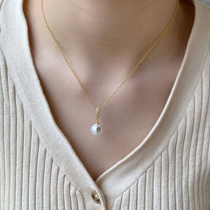 "Ocean Whisper: Silver and Pearl Pendant"