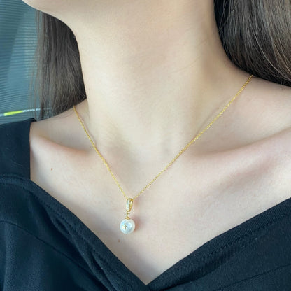 "Ocean Whisper: Silver and Pearl Pendant"