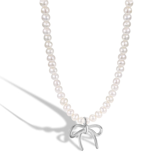 Freshwater pearl necklace with a silver bow.