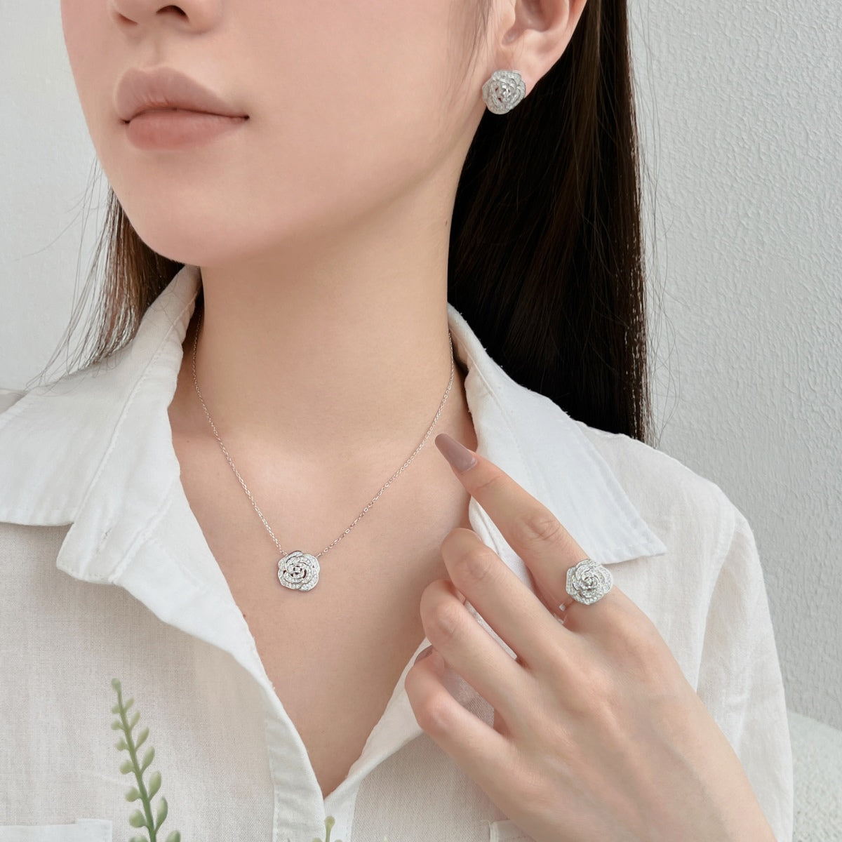 "Blooming Grace: Sterling Silver Necklace with Rosy Floral Motif"