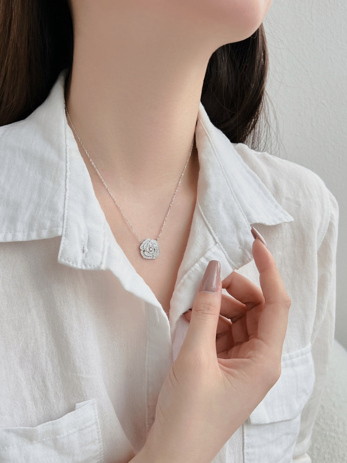 "Blooming Grace: Sterling Silver Necklace with Rosy Floral Motif"