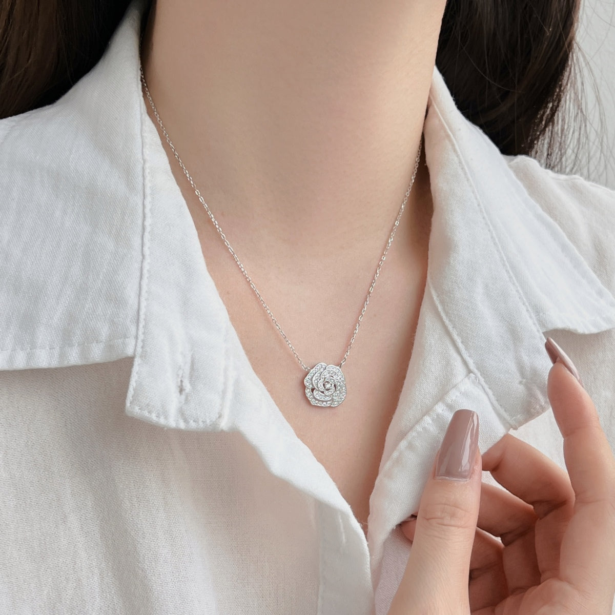"Blooming Grace: Sterling Silver Necklace with Rosy Floral Motif"