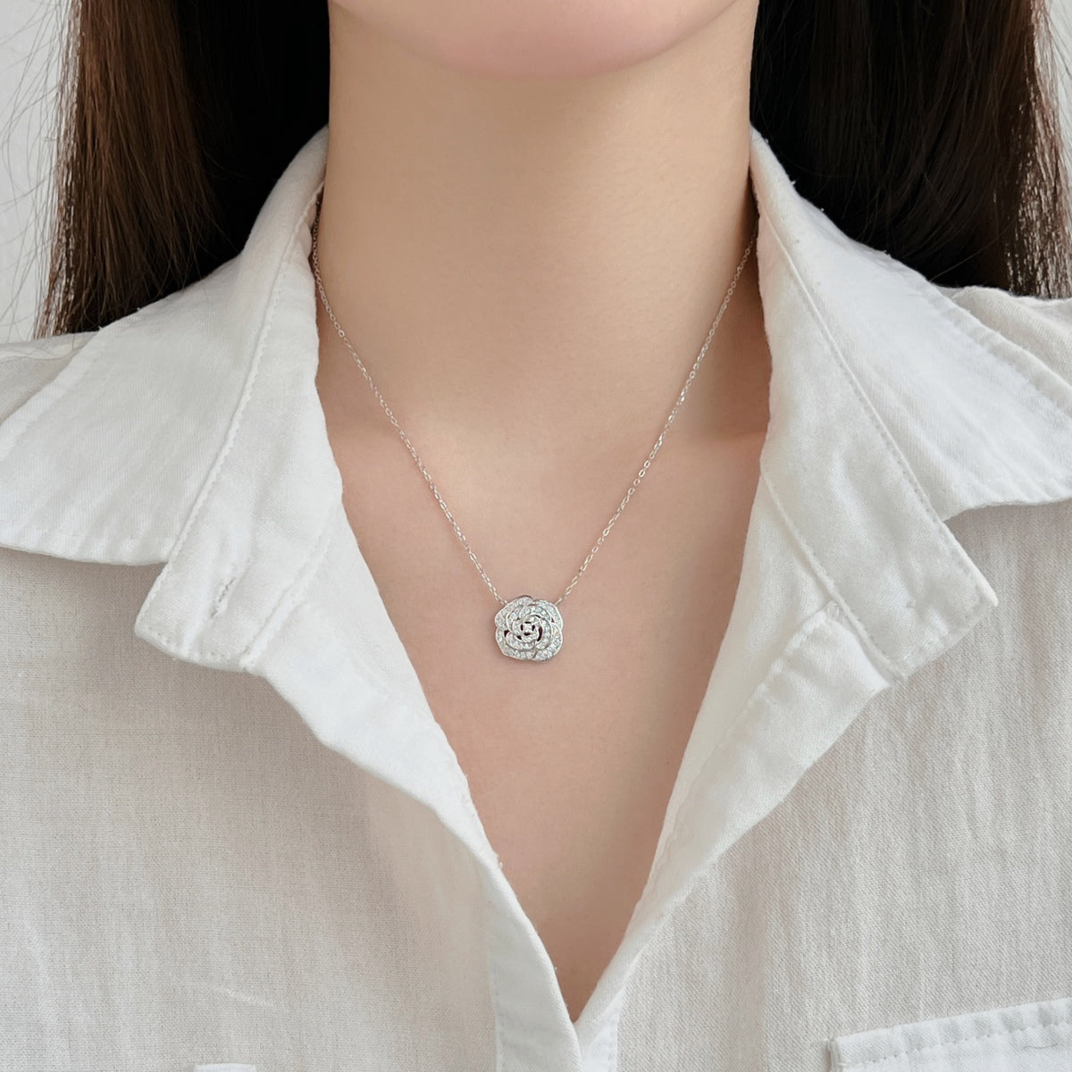 "Blooming Grace: Sterling Silver Necklace with Rosy Floral Motif"