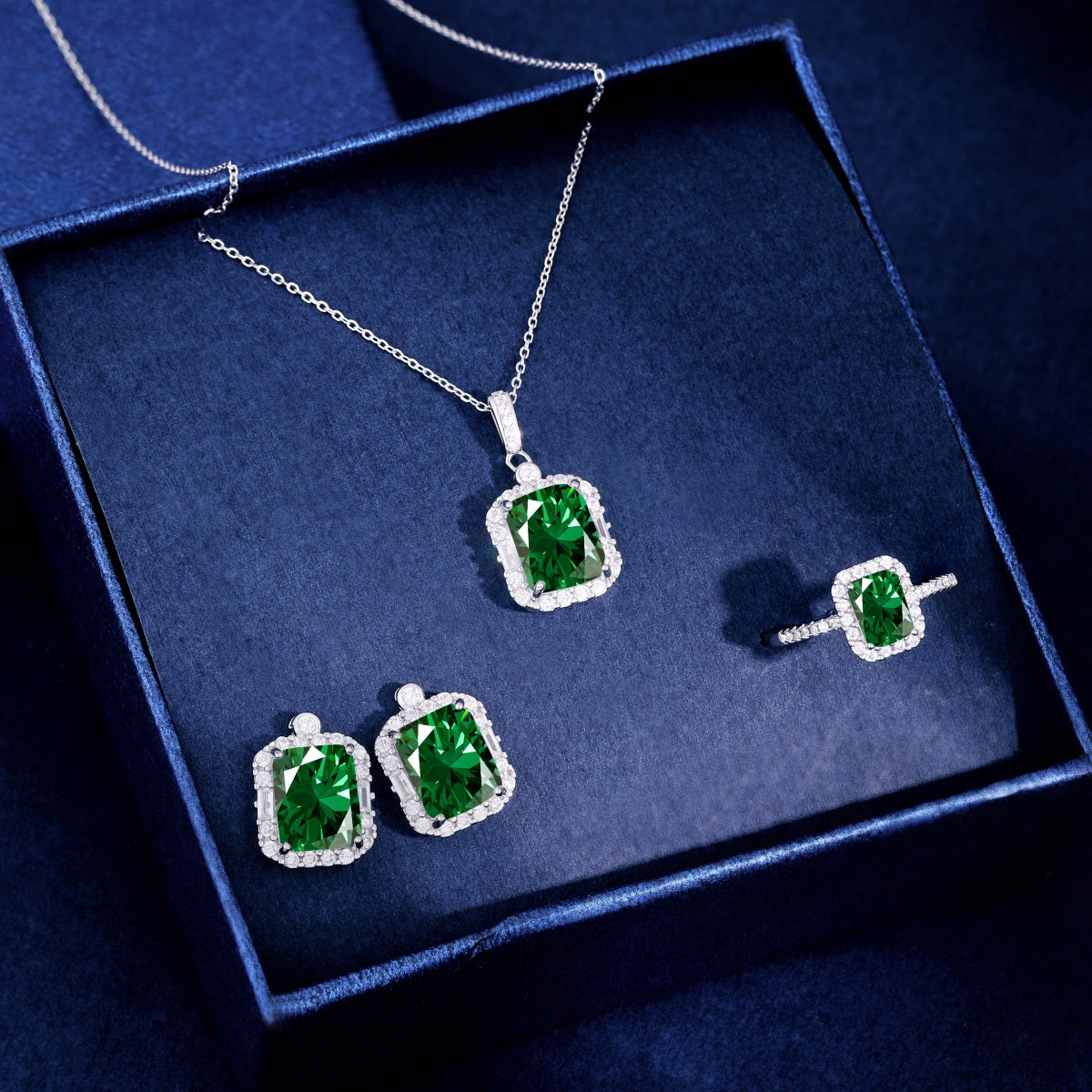 "Enchanting Baguettes: Silver Earrings with Green Zirconia Accents"