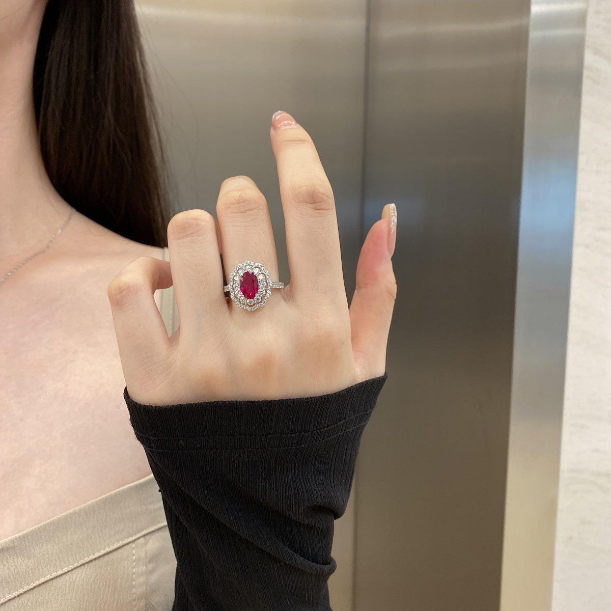 Silver ring with purple zirconia."