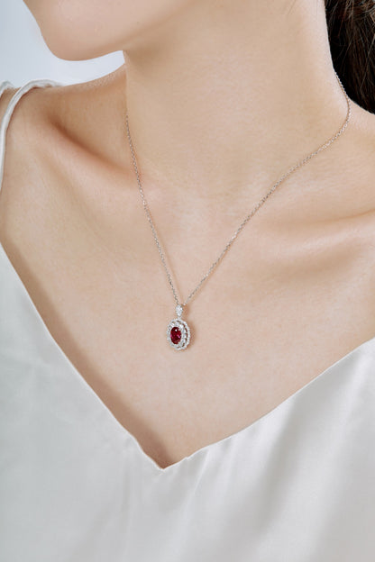 "Silver Necklace with Purple Zirconia."
